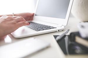 kaboompics.com_Closeup_of_woman_hand_typing_on_laptop_keyboard.jpg